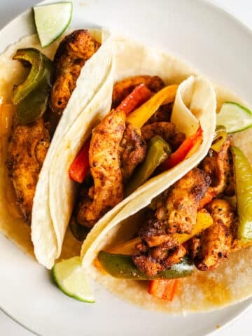 Chicken fajitas on a plate.