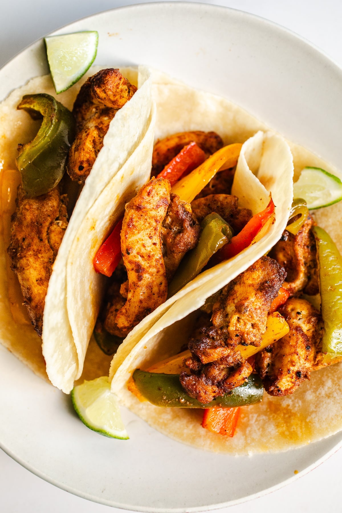 Chicken fajitas on a plate.