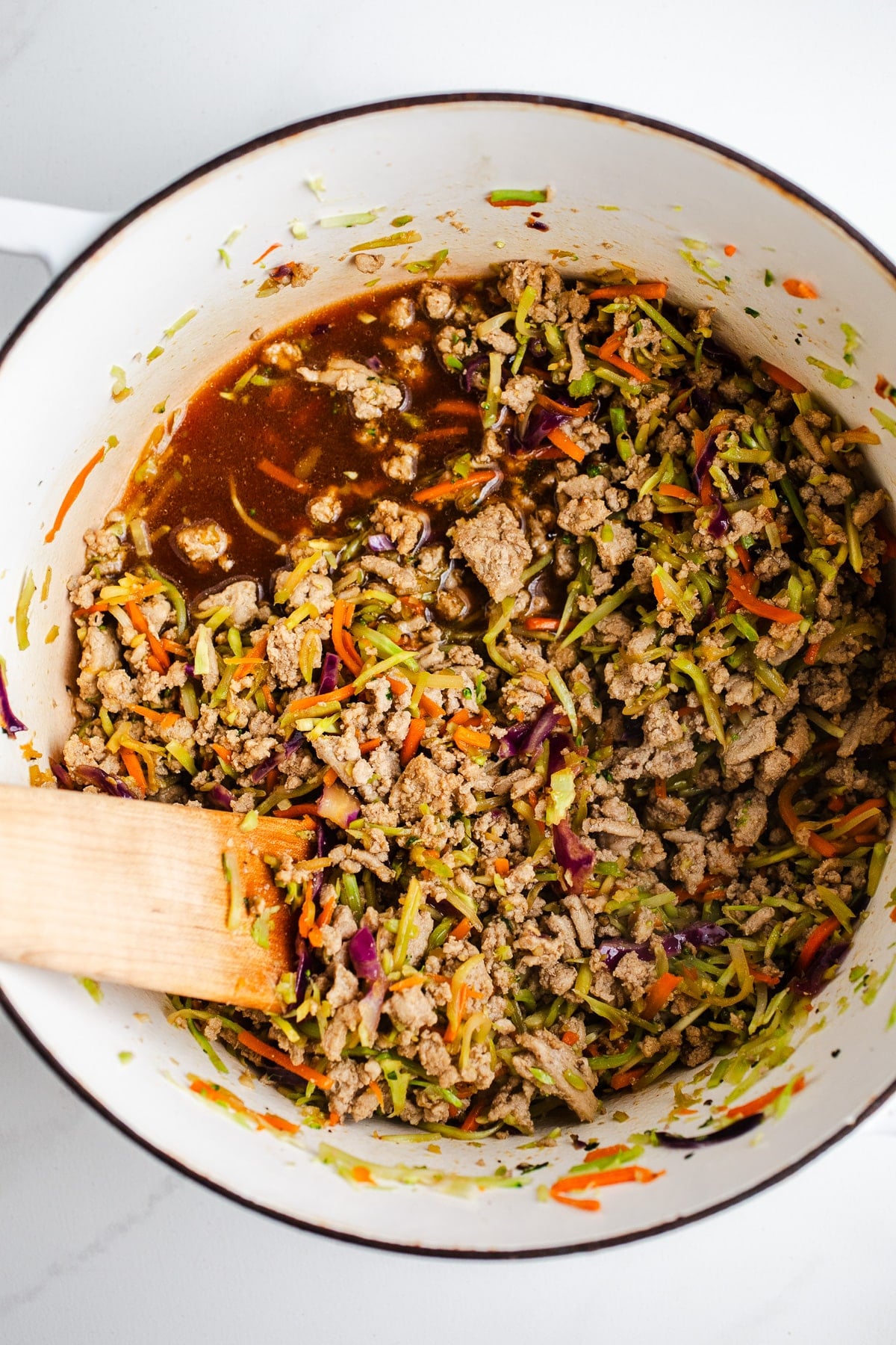 Soy sauce in a pot with turkey and veggies.