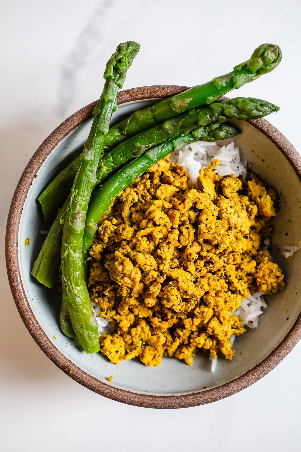 Ground turkey bowl with asparagus over rice.