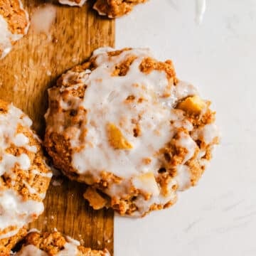 Baked apple fritters on a serving board.