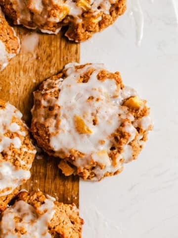 Baked apple fritters on a serving board.