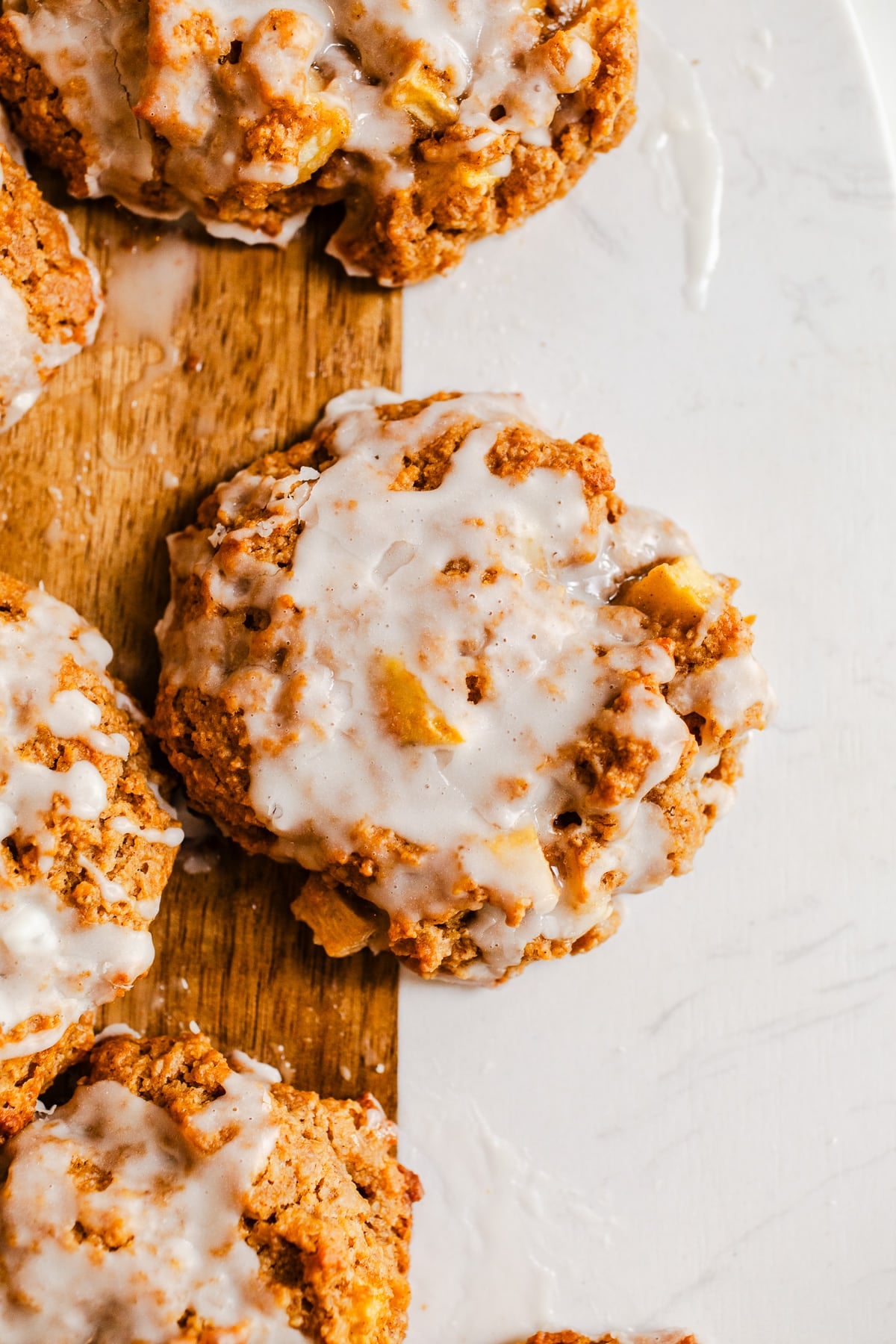 Baked apple fritters on a serving board.