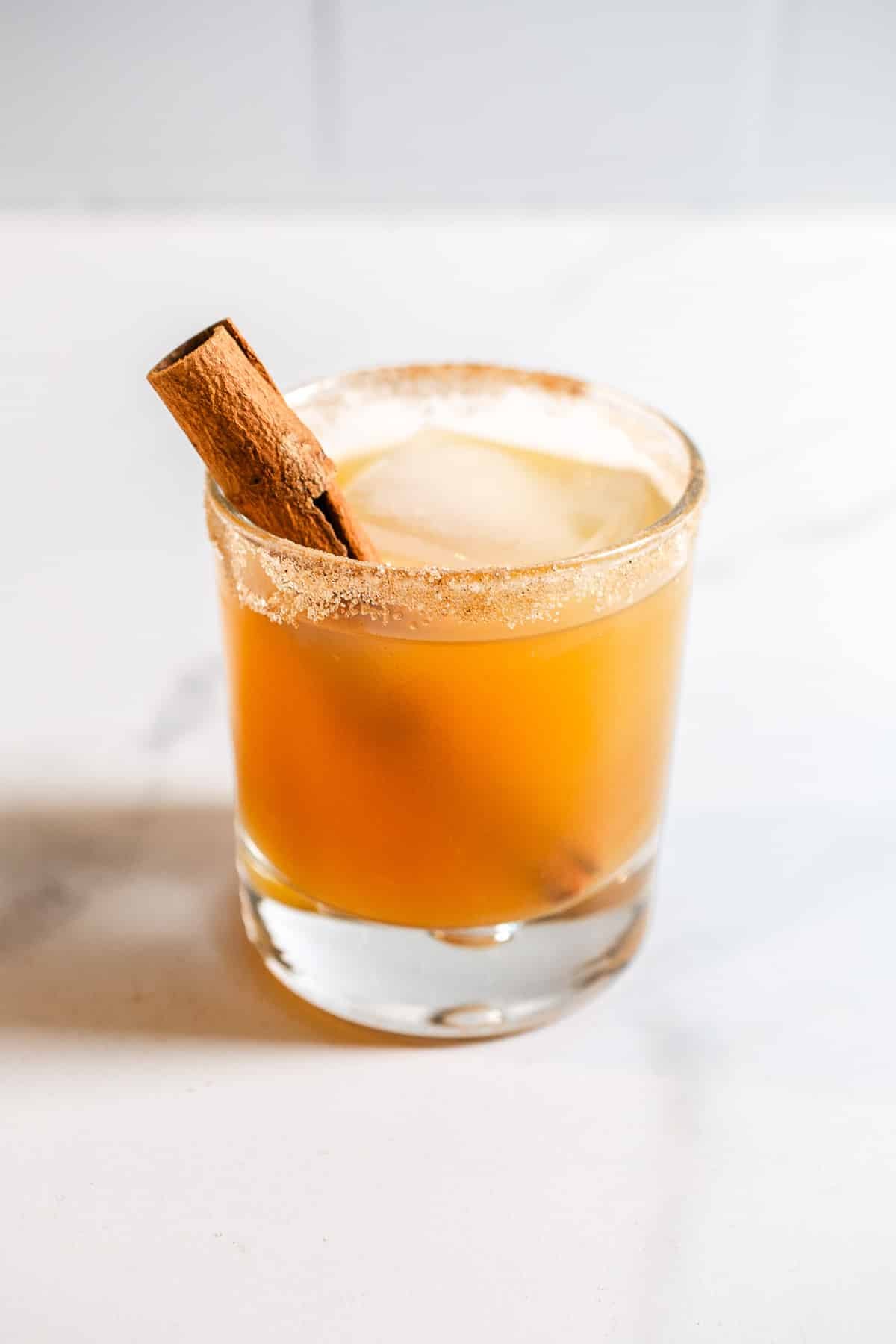 Apple cider cocktail in a rocks glass.